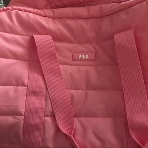 Victoria’s Secret pink duffel bag.
